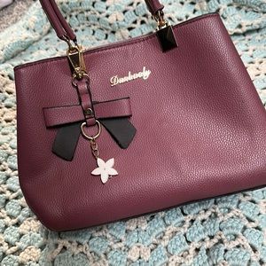 Danbaoly maroon mini purse.